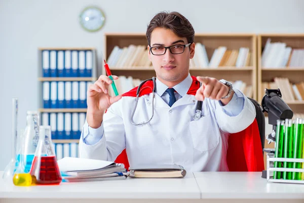 Superhero doctor working in the hospital lab