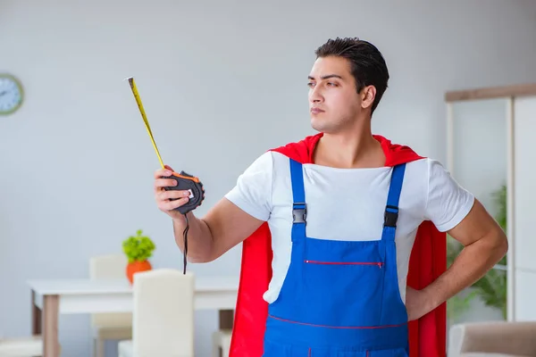 Super hero repairman working at home — Stock Photo, Image