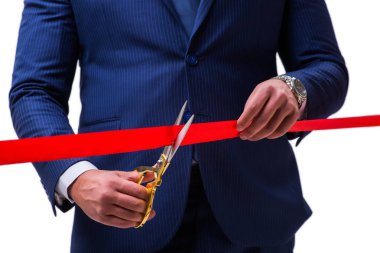 Businessman cutting red ribbon isolated on white clipart