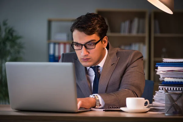 Businessman staying in the office for long hours — Stock Photo, Image