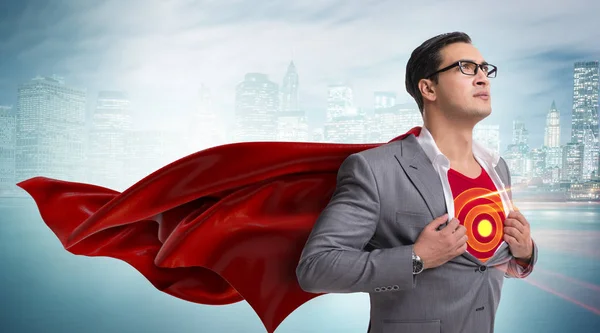 Businessman in superhero concept with red cover