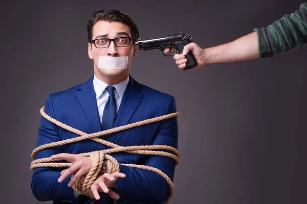 Businessman taken hostage and tied up with rope — Stock Photo, Image