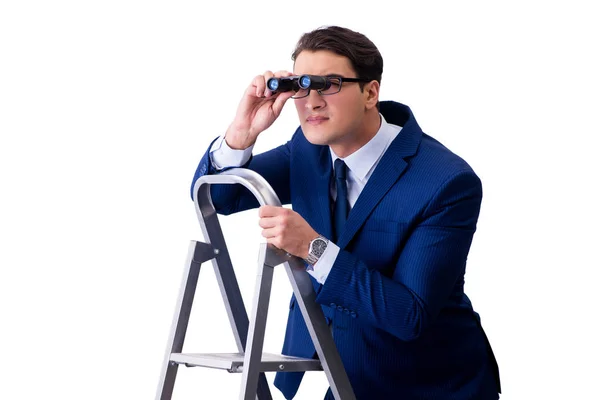 Podnikatel v horní části žebříku s dalekohledem — Stock fotografie