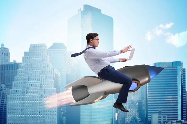 Businessman flying on rocket in business concept — Stock Photo, Image