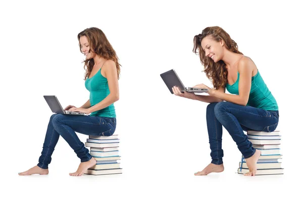 Studente con netbook seduto sui libri — Foto Stock