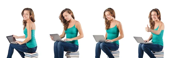 Student with netbook sitting on books — Stock Photo, Image