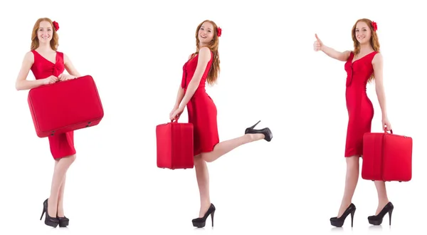 Ung kvinna i röd klänning med resväska isolerad på vit — Stockfoto