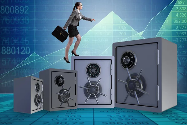 Businesswoman walking on top of safe — Stock Photo, Image