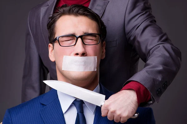 Businessman taken hostage and tied up with rope — Stock Photo, Image