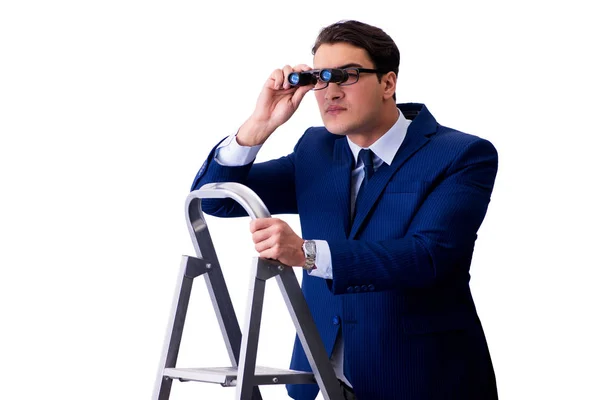 Podnikatel v horní části žebříku s dalekohledem — Stock fotografie