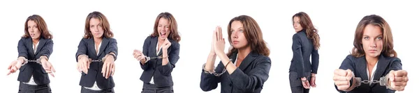 Female businesswoman with handcuffs on white — Stock Photo, Image