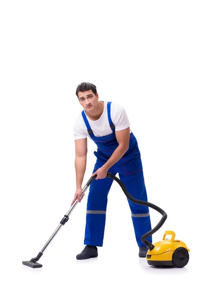 Man in coveralls doing vacuum cleaning on white — Stock Photo, Image