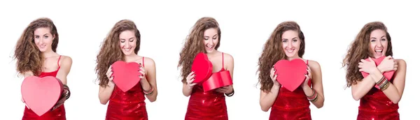 Kvinna i röd klänning med julklappar — Stockfoto