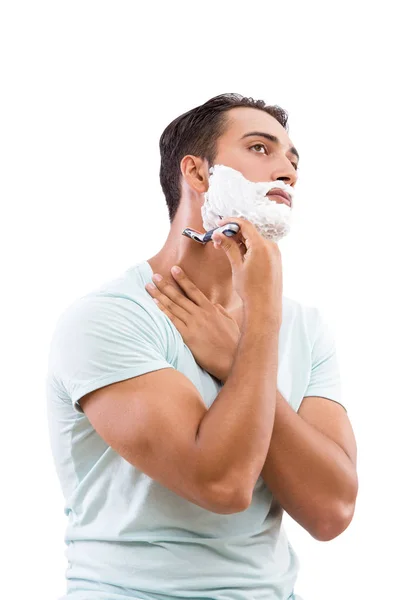 Hombre guapo afeitándose aislado en blanco — Foto de Stock