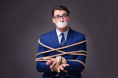 Businessman taken hostage and tied up with rope clipart