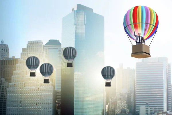 Businessman flying on balloon in challenge concept — Stock Photo, Image