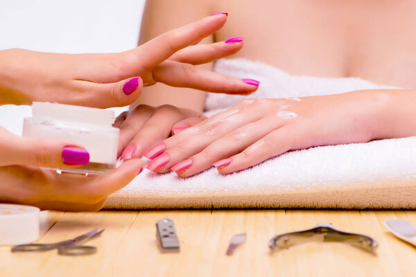 Woman hands during manicure procedure