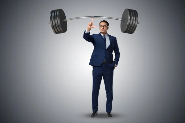 Zakenman met barbell in zware werk concept — Stockfoto