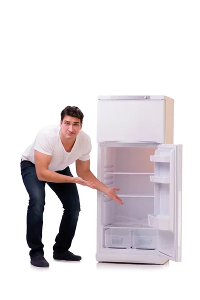 Man op zoek naar voedsel in lege koelkast — Stockfoto