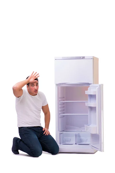 Man looking for food in empty fridge — Stock Photo, Image