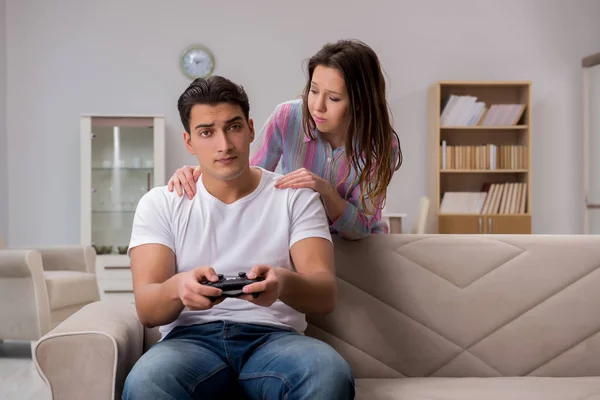 Young family suffering from computer games addiction — Stock Photo, Image