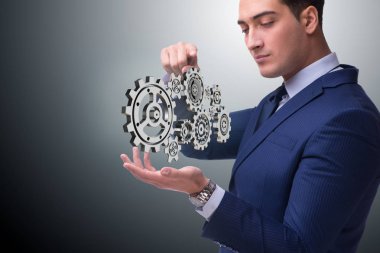 Ekip çalışması kavramı ile cogwheels Businessnman