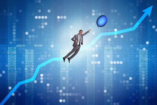 Affärsman som flyger på varm ballong över grafen — Stockfoto