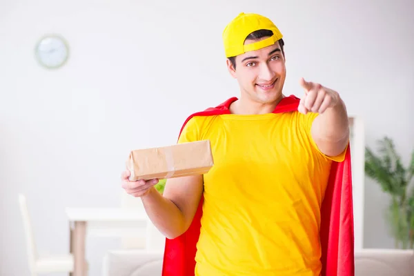 Superhero delivery guy with box — Stock Photo, Image