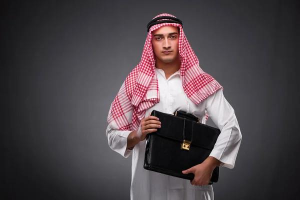 Arab businessman on gray background — Stock Photo, Image