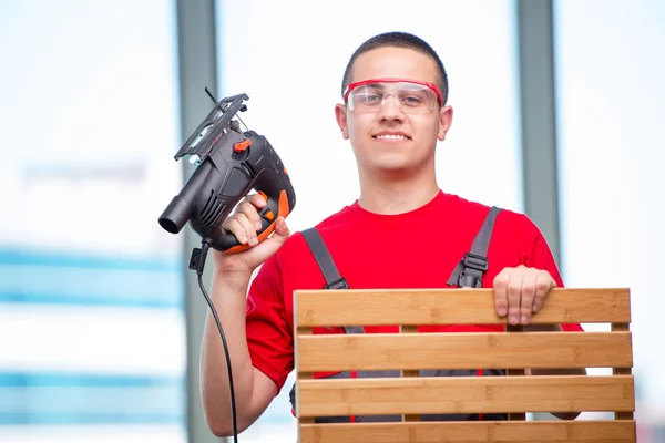 Young furniture carpenter in industrial concept — Stock Photo, Image