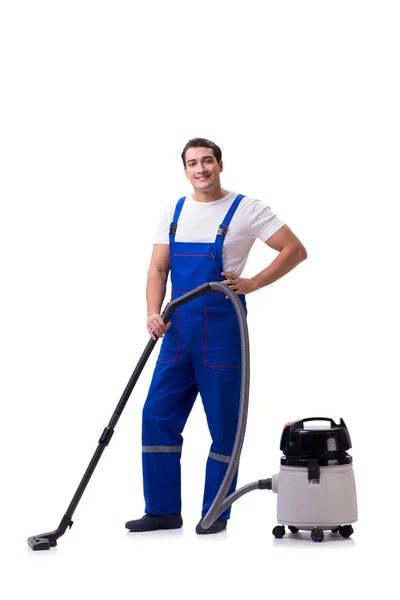 Man in coveralls doing vacuum cleaning on white — Stock Photo, Image