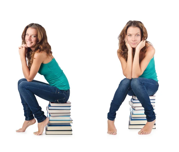 Student sitzt auf Bücherstapel — Stockfoto