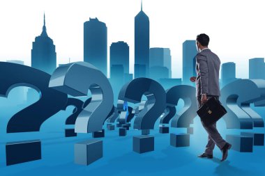 Soru işaretleriyle belirsizlik konseptinde iş adamı