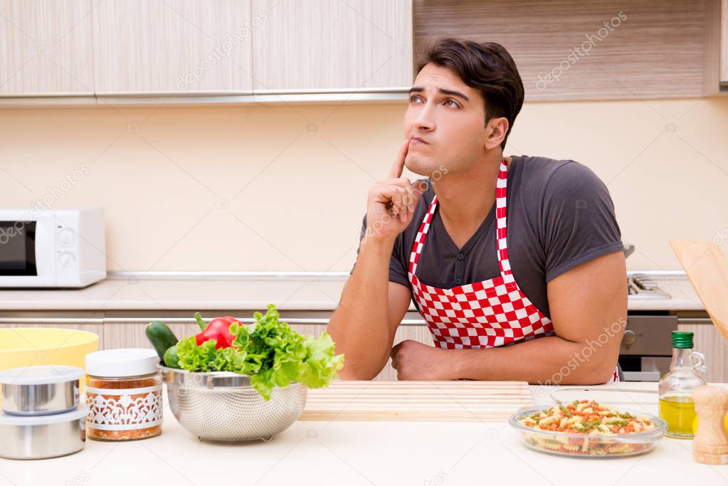 Man male cook preparing food in kitchen