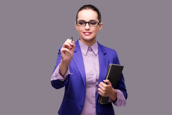 Businesswoman pressing virtual button with pen — Stock Photo, Image