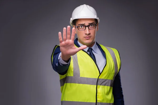 Man wearing hard hat and construction vest