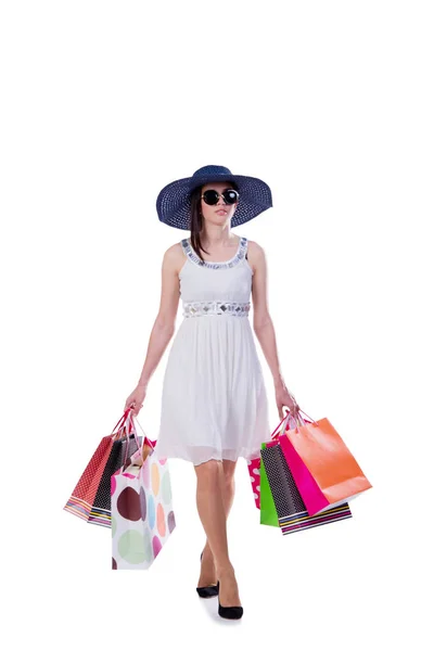 Jonge vrouw met kerst shopping tassen op wit — Stockfoto