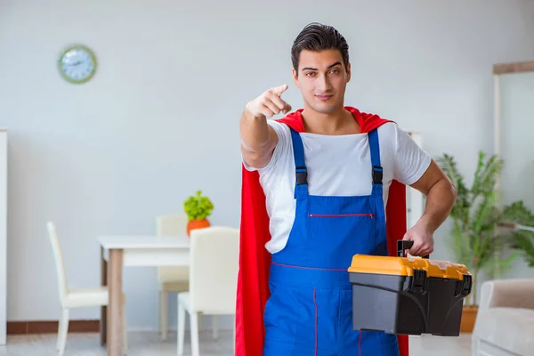 Super hero repairman working at home — Stock Photo, Image
