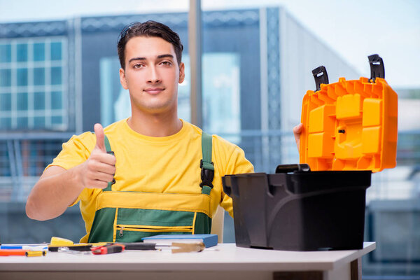 Construction worker sitting at the desk