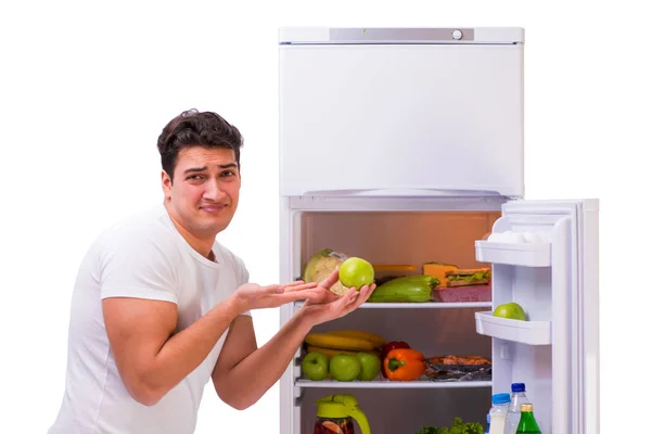 Adamın yanında buzdolabı kadar dolu — Stok fotoğraf