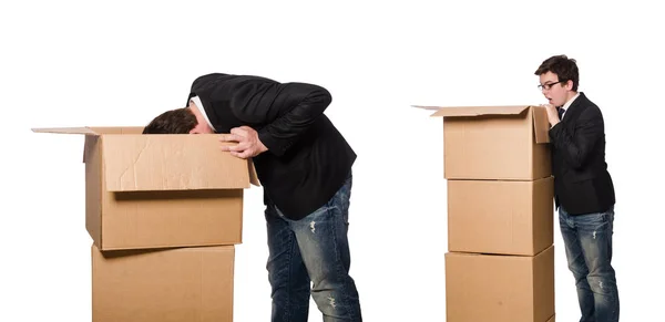 Hombre divertido con cajas aisladas en blanco — Foto de Stock