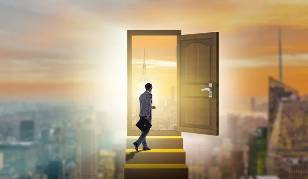 Businessman walking towards open door — Stock Photo, Image