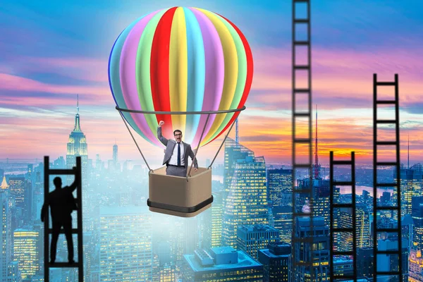 Career achievement concept with businessman on balloon and ladde