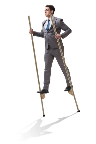 Businessman walking on stilts - standing out from the crowd — Stock Photo, Image