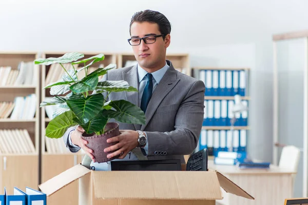 Man moving office with box and his belongings