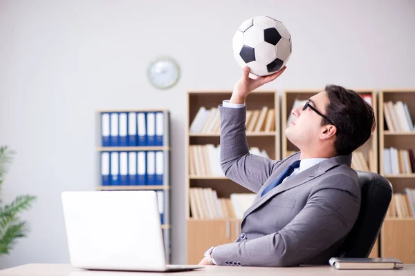 Businessman with football ball in office — Stock Photo, Image