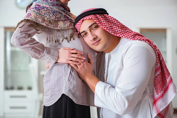 Young arab muslim family with pregnant wife expecting baby — Stock Photo, Image