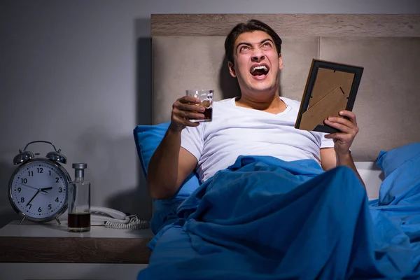 Desperate man divorced in bed — Stock Photo, Image