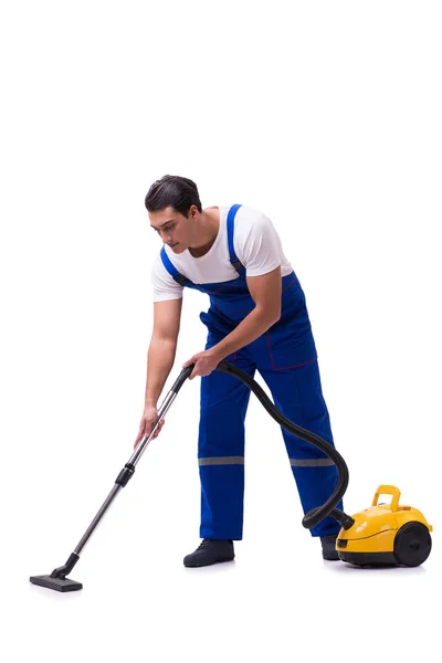 Man in coveralls doing vacuum cleaning on white — Stock Photo, Image
