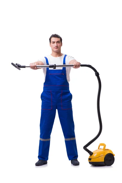 Man in overall doen vacuüm reiniging op wit — Stockfoto